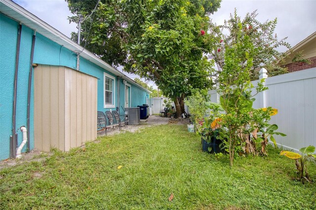 view of yard with central air condition unit