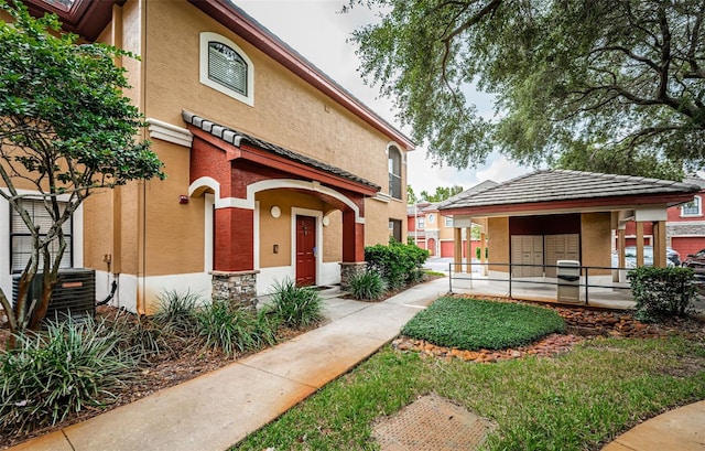 view of front of home with central air condition unit