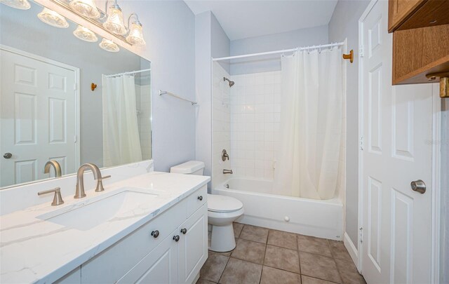 full bathroom with tile patterned flooring, toilet, shower / tub combo, and vanity