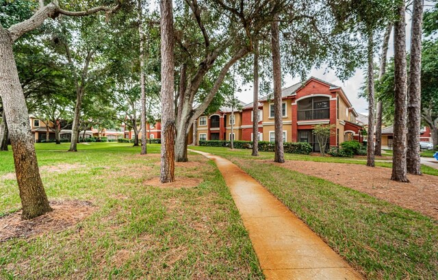 surrounding community featuring a yard