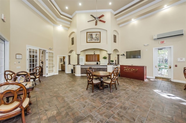 dining room featuring crown molding, french doors, ceiling fan, high vaulted ceiling, and an AC wall unit