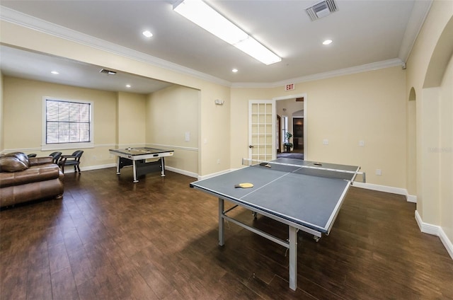 playroom featuring ornamental molding and dark hardwood / wood-style floors