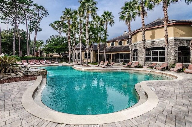 view of swimming pool featuring a patio area