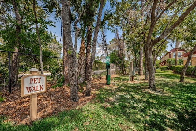 view of property's community featuring a yard