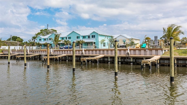 dock area featuring a residential view and a water view