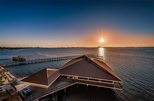 view of dock with a water view and central AC