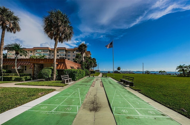 view of home's community featuring a lawn