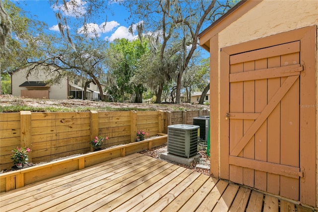 wooden deck with central AC unit