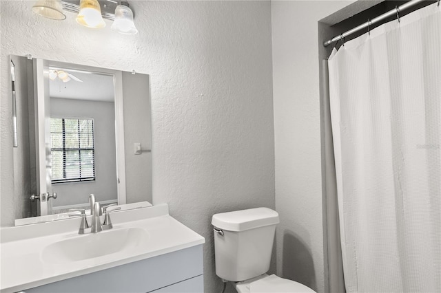 bathroom with vanity, toilet, and a shower with shower curtain