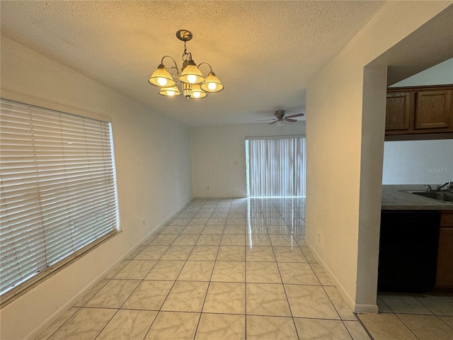 empty room featuring ceiling fan with notable chandelier, a textured ceiling, and light tile patterned flooring