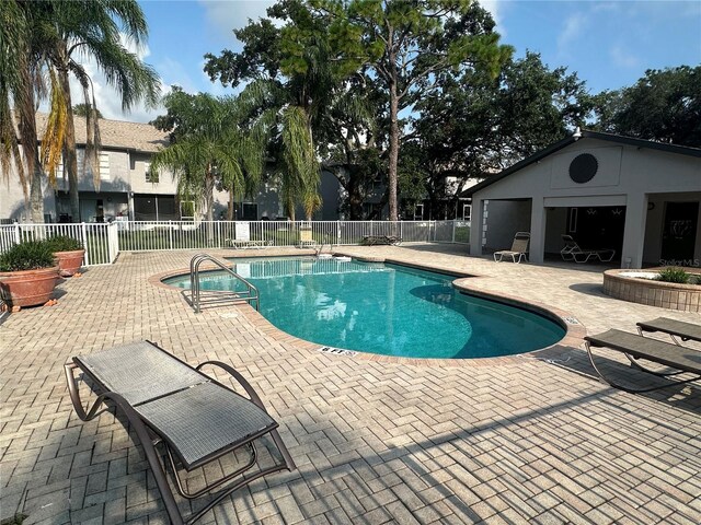 view of pool featuring a patio area