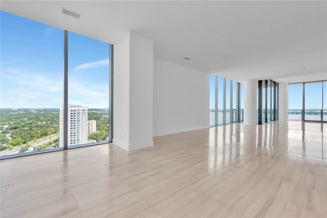 empty room with floor to ceiling windows