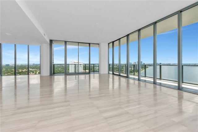 interior space with a healthy amount of sunlight and a wall of windows