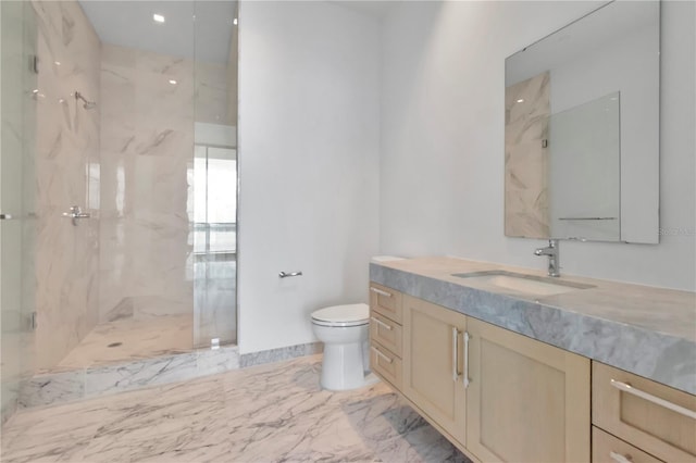 bathroom with vanity, toilet, and an enclosed shower