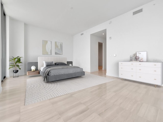 bedroom with light wood-type flooring