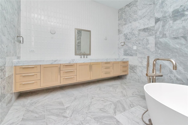 bathroom with tile walls, shower with separate bathtub, and vanity