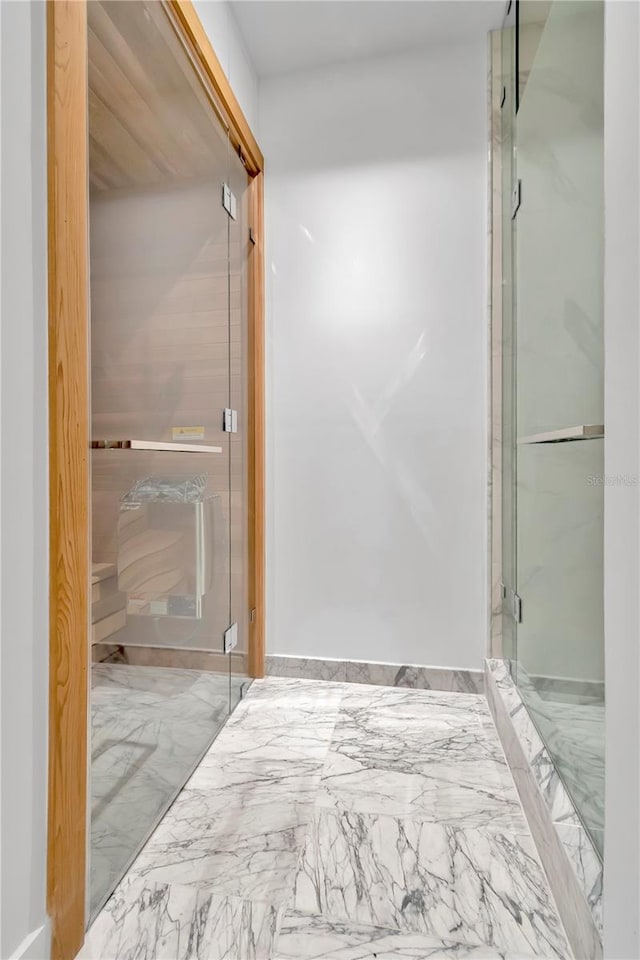 bathroom featuring an enclosed shower