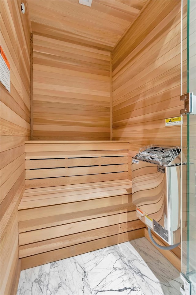 view of sauna / steam room with wooden walls and wooden ceiling