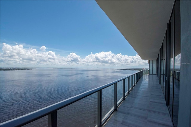 balcony featuring a water view