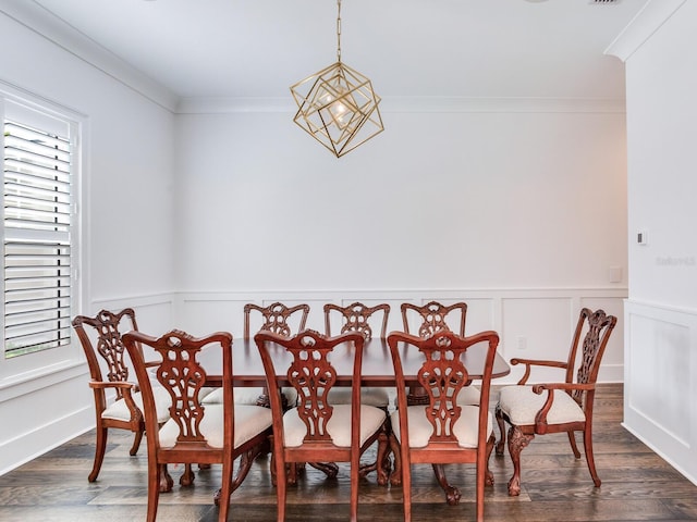 dining area with a notable chandelier, plenty of natural light, ornamental molding, and dark hardwood / wood-style flooring