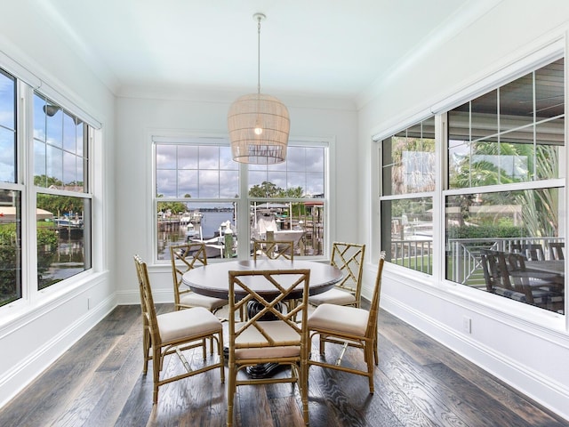 dining room with dark hardwood / wood-style floors and ornamental molding