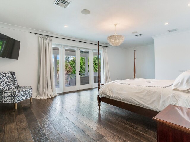 bedroom featuring access to outside, ornamental molding, dark hardwood / wood-style floors, and french doors