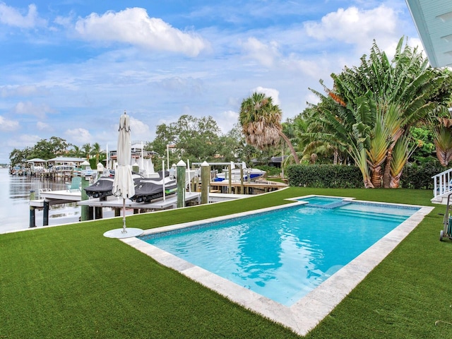 view of pool featuring a dock, a yard, and a water view