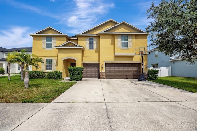 view of front of property featuring a garage and a front yard