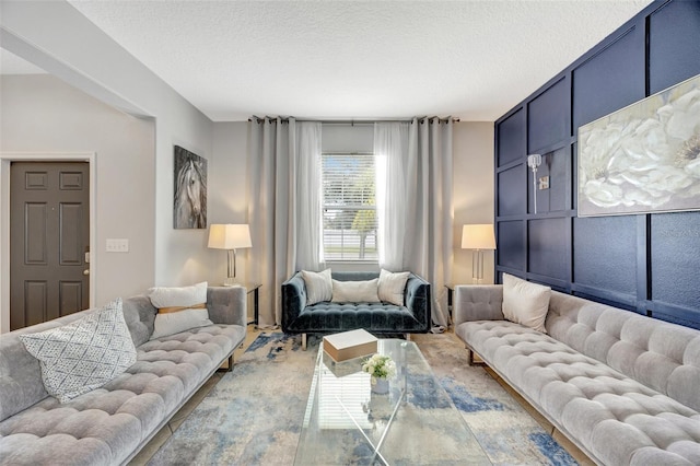 living room featuring a textured ceiling