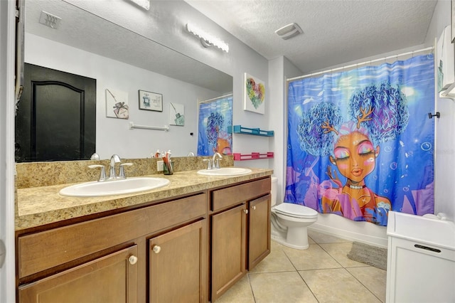 full bathroom featuring tile patterned floors, toilet, vanity, shower / bath combo with shower curtain, and a textured ceiling