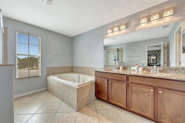 bathroom featuring vanity, tile patterned floors, and shower with separate bathtub