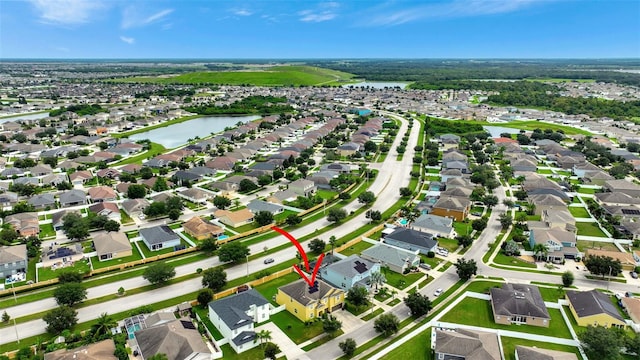 10820 Carloway Hills Dr, Wimauma, FL 33598 - drone / aerial view with a residential view and a water view