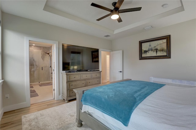 2860 14th Ave N, Saint Petersburg, FL 33713 - bedroom featuring visible vents, baseboards, a ceiling fan, light wood-type flooring, and a tray ceiling