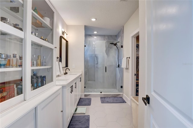 2860 14th Ave N, Saint Petersburg, FL 33713 - full bathroom with tile patterned flooring, vanity, recessed lighting, a textured ceiling, and a stall shower