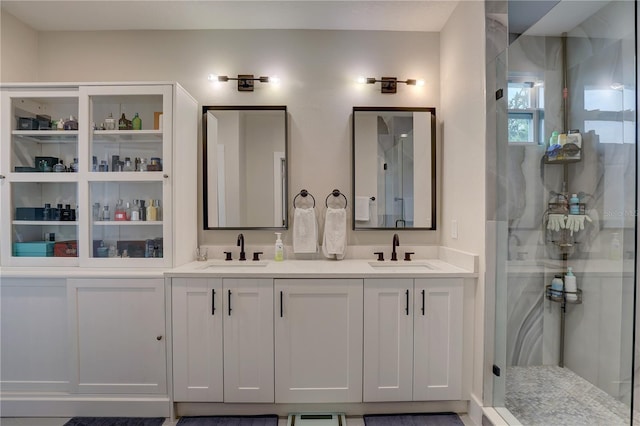 bathroom with vanity and an enclosed shower