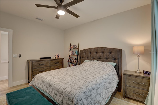 bedroom with ceiling fan and light hardwood / wood-style floors