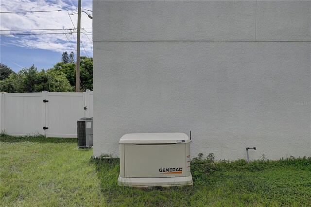 2860 14th Ave N, Saint Petersburg, FL 33713 - details with a gate, fence, stucco siding, a power unit, and cooling unit