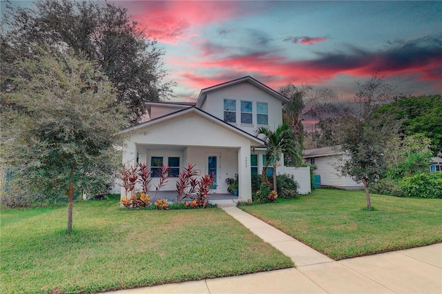 2860 14th Ave N, Saint Petersburg, FL 33713 - bungalow featuring a porch, stucco siding, and a front lawn