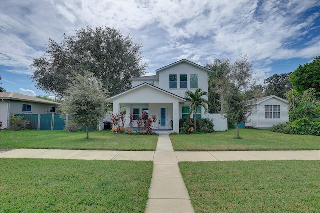 view of front of house featuring a front yard and a porch