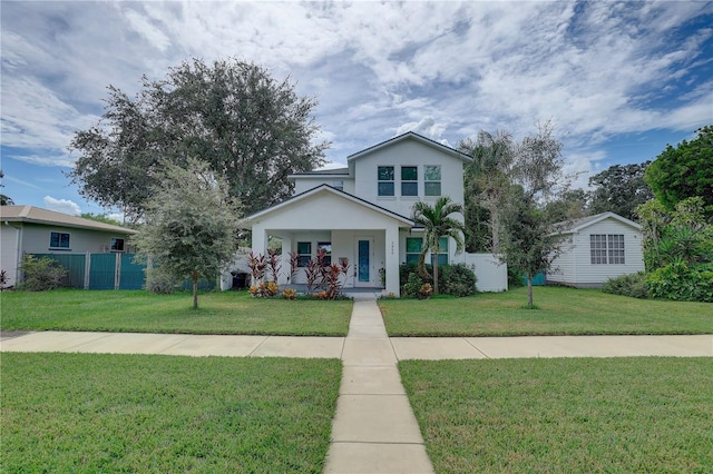 2860 14th Ave N, Saint Petersburg, FL 33713 - view of front of home featuring stucco siding, covered porch, fence, and a front lawn