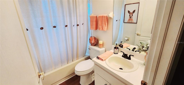 full bathroom with vanity, toilet, shower / tub combo with curtain, and hardwood / wood-style flooring