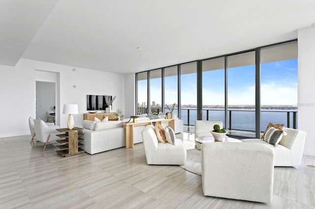 living room featuring a wall of windows