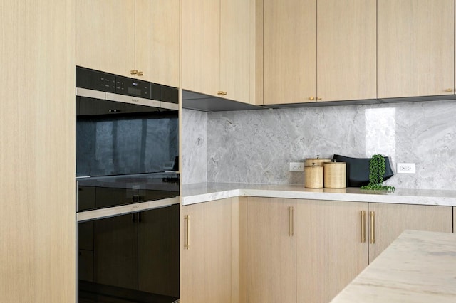 kitchen featuring light brown cabinets and decorative backsplash