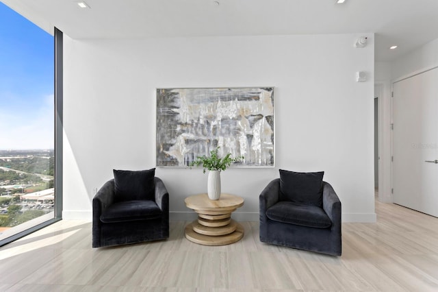 sitting room with light hardwood / wood-style floors