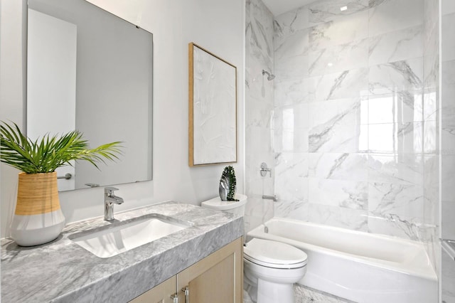 full bathroom with toilet, tiled shower / bath combo, and vanity