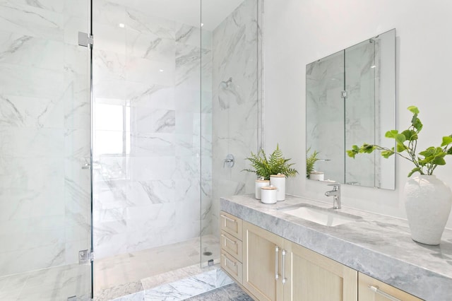 bathroom with vanity and a shower with door