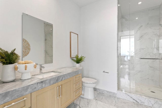 bathroom featuring vanity, toilet, and an enclosed shower