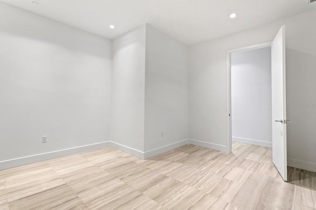 spare room with light hardwood / wood-style flooring