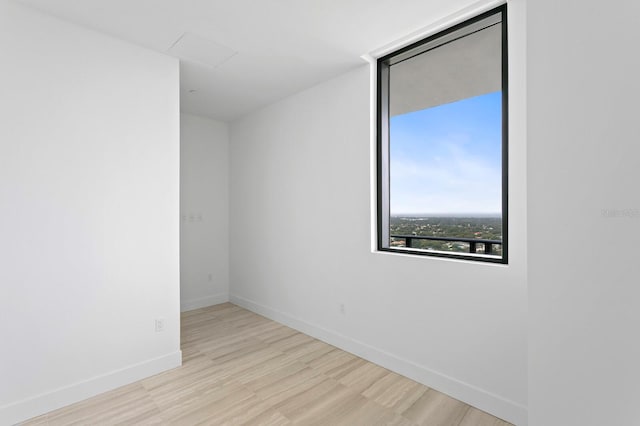 spare room featuring light hardwood / wood-style floors