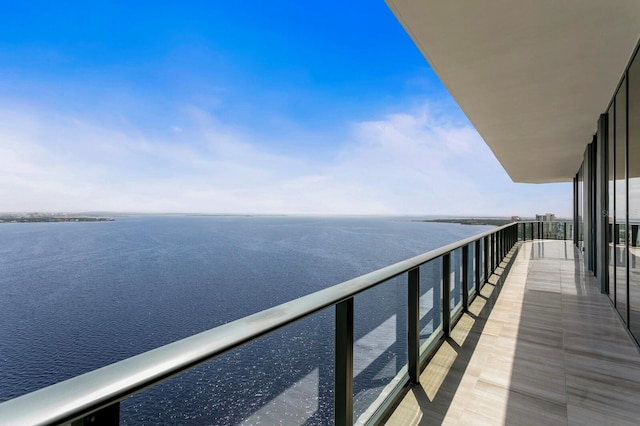 balcony featuring a water view